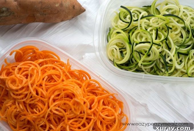 Various spiralized vegetables stored in containers for meal prep