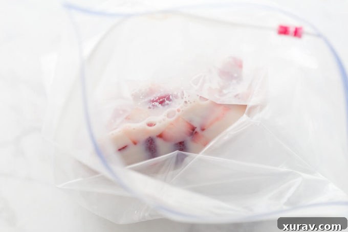 Homemade vanilla ice cream made in a Ziploc bag, ready to eat.