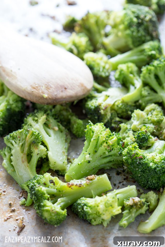 A close-up of beautifully caramelized garlic roasted broccoli, fresh out of the oven.