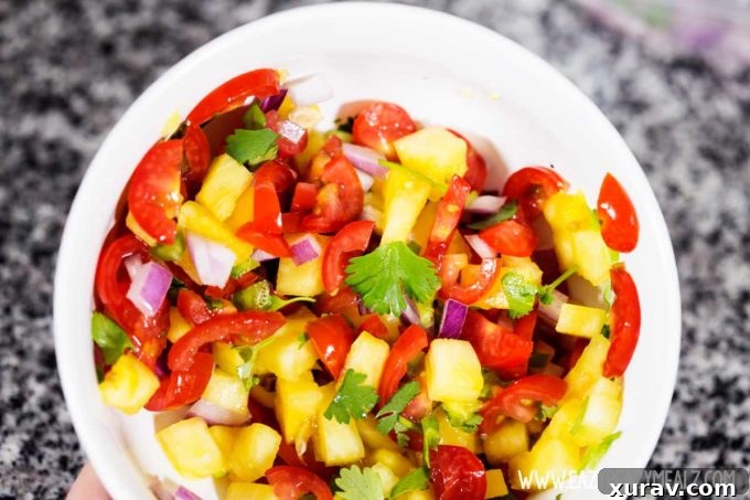 A vibrant pineapple fruit salsa, ideal for pairing with shrimp tacos and naan shrimp tacos.