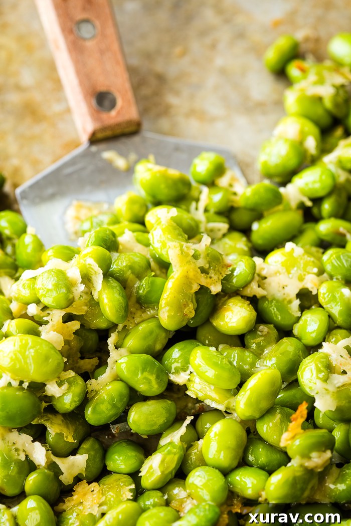 Golden Parmesan Edamame Bites 3 Close-up of crispy roasted edamame sprinkled with Parmesan cheese
