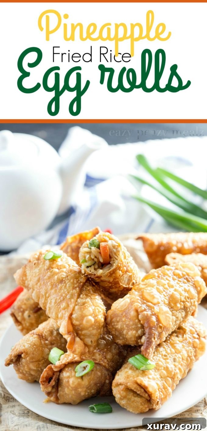 Crispy Pineapple Fried Rice Egg Rolls on a plate, ready to be served