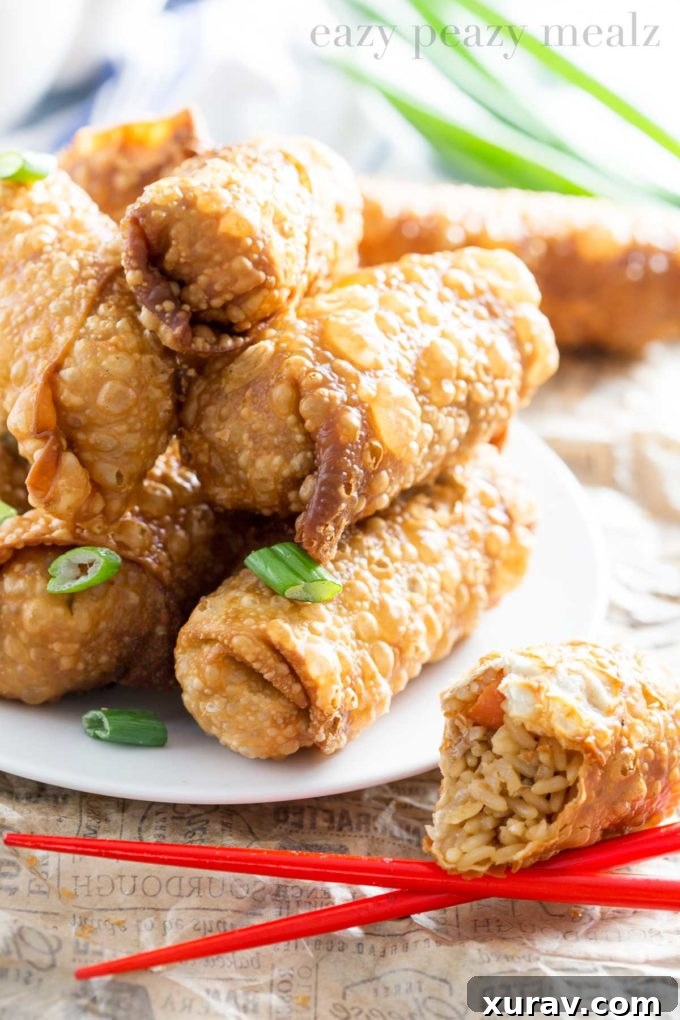 Close-up of golden brown egg rolls, showcasing their crispy texture