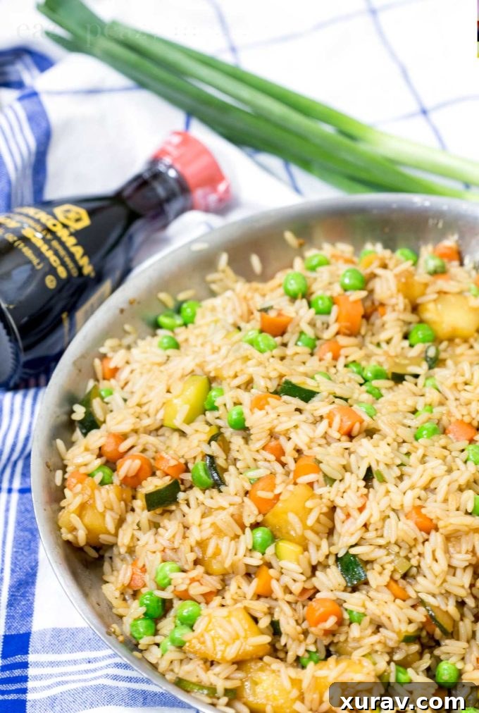 Delicious pineapple fried rice in a skillet, ready for egg roll filling