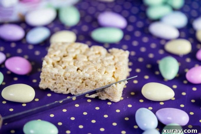 Step 1: Cutting the corners of a Rice Krispies Treat bar to begin shaping the Easter basket base.