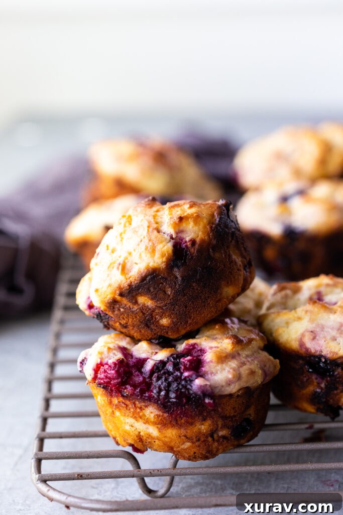 Moist, decadent, delicious triple berry muffins, loaded with juicy summer berries for Mother's Day