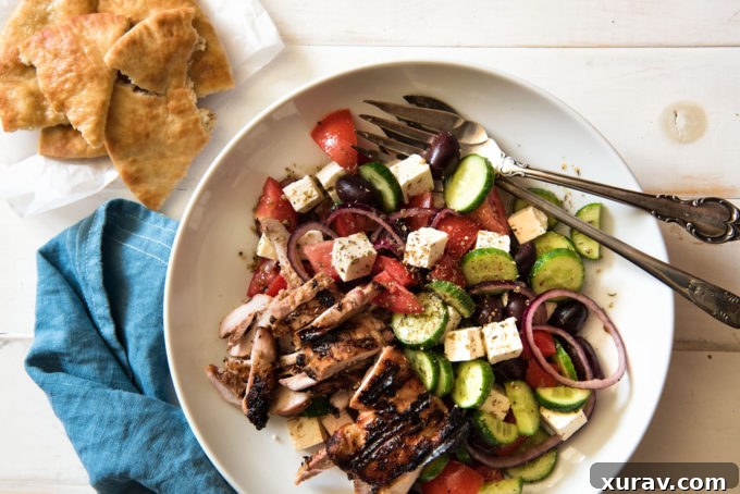 Greek Salad with a rich, vibrant homemade dressing poured over fresh vegetables