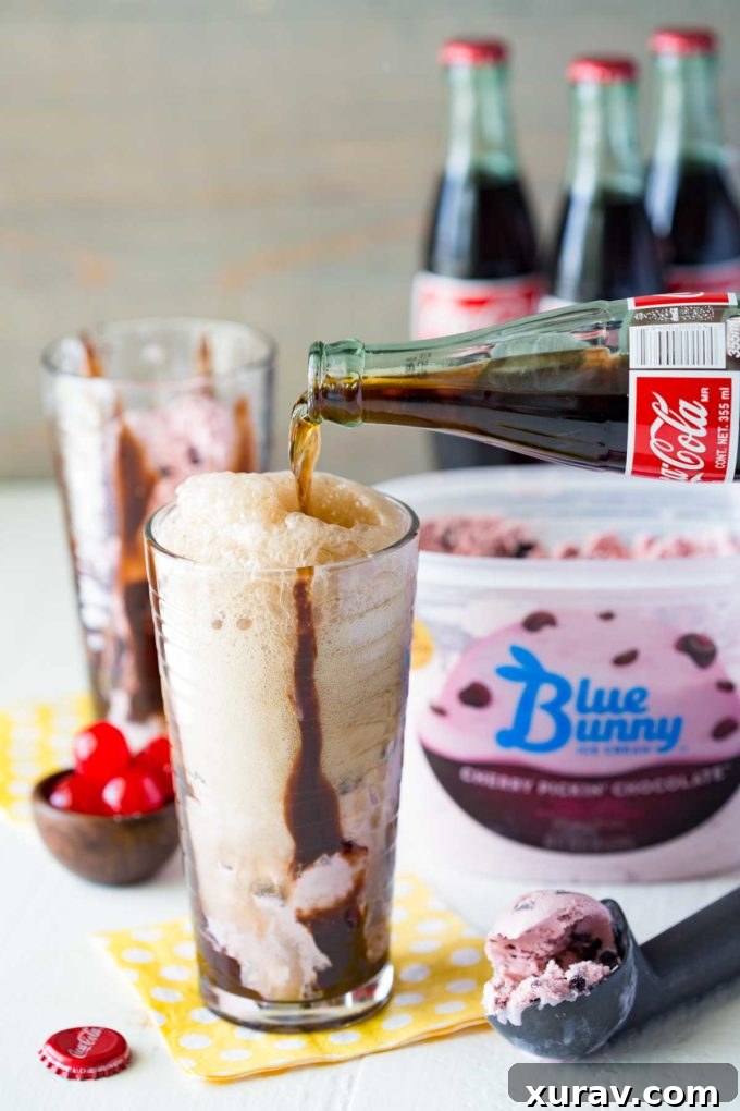 Delicious Cherry Chocolate Coke Float with whipped cream and a cherry garnish