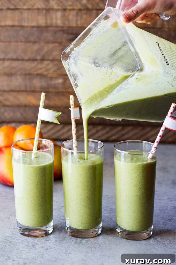 Collagen Beauty Greens being poured into a blender, ready to create a vibrant green smoothie with mango