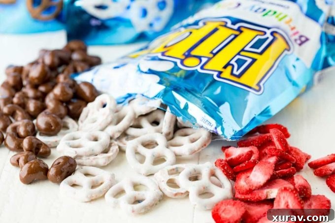 Close-up of Neapolitan Snack Mix featuring FLIPZ pretzels, chocolate nuts, and freeze-dried strawberries, ready for a family road trip.