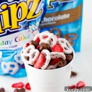 Neapolitan Snack Mix made with chocolate covered nuts, FLIPZ Birthday Cake, and freeze dried strawberries