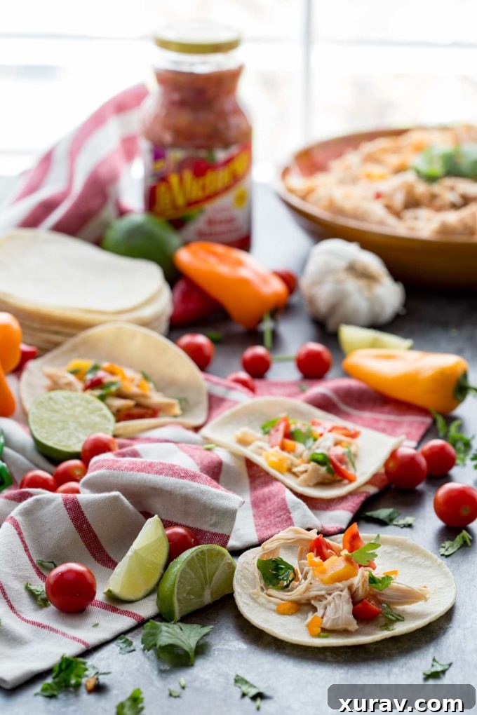 An array of delicious Mango Habanero Tacos, featuring easily shredded chicken cooked in a slow cooker, arranged on a rustic wooden board.