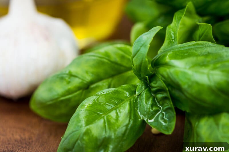Homemade Basil Pesto - A close-up of fresh basil leaves, pine nuts, and garlic, key ingredients for pesto.