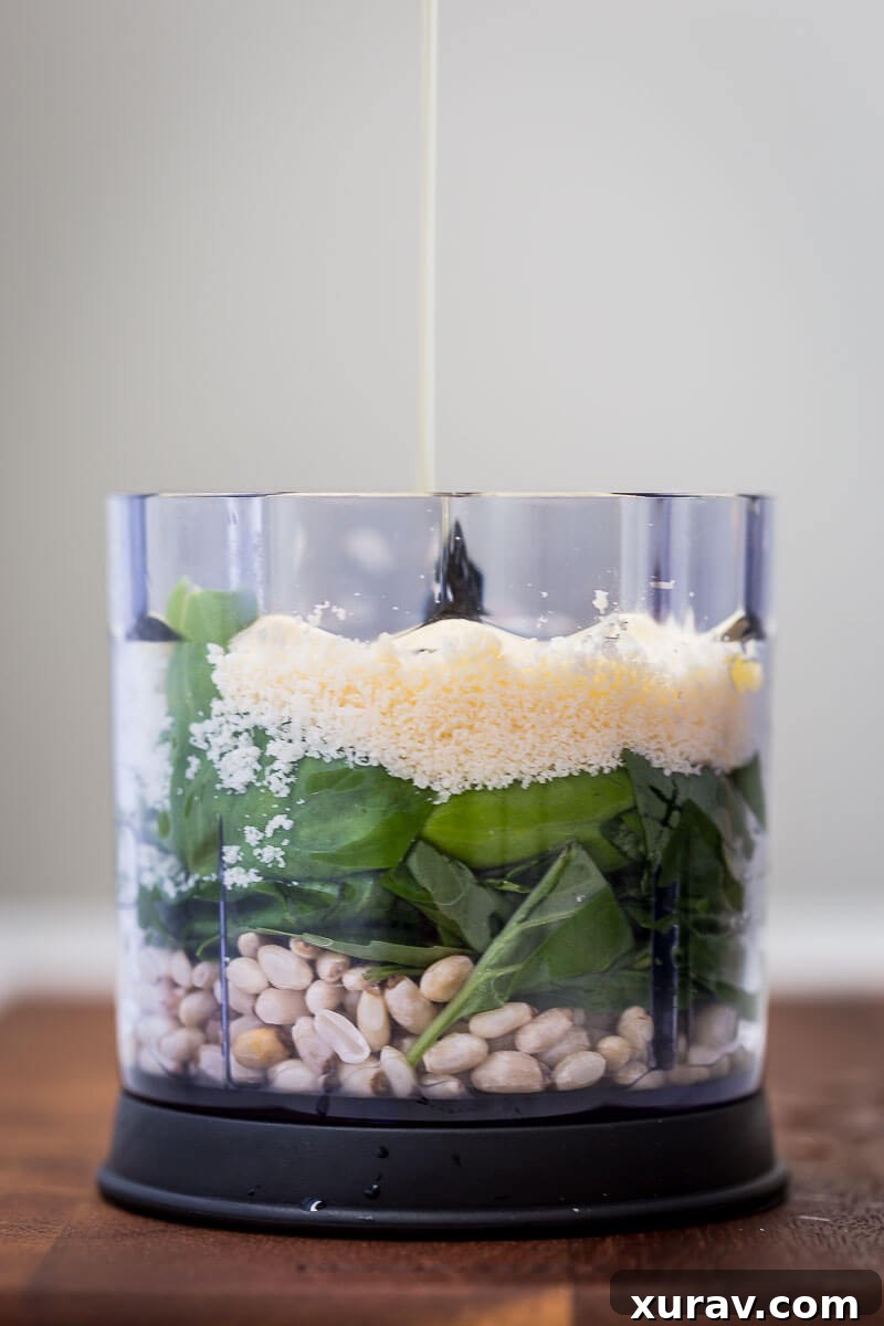 Homemade Basil Pesto - A jar of freshly made basil pesto with a spoon, ready to be served.