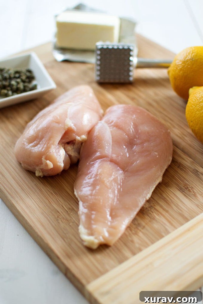 Close-up of golden-brown Lemon Chicken Piccata with lemon slices