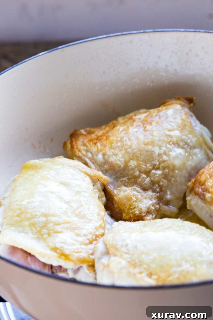 Chicken browning in a hot skillet for the Skillet Garlic Lemon Chicken with White Wine Sauce