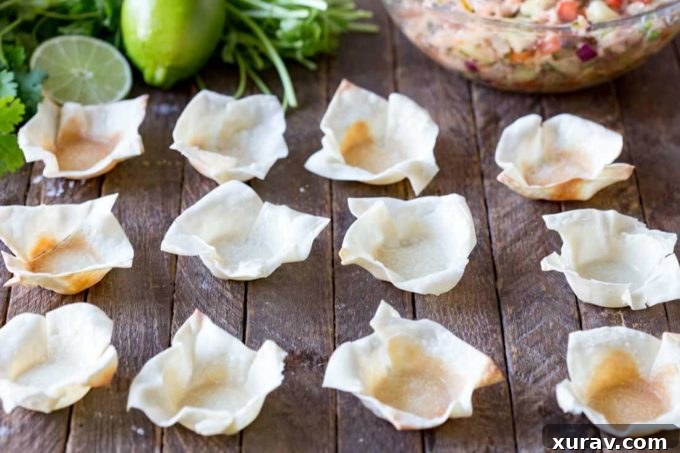 Crispy wonton wrappers elegantly shaped into cups, ideal for holding delicious appetizers and adding a delightful crunch.