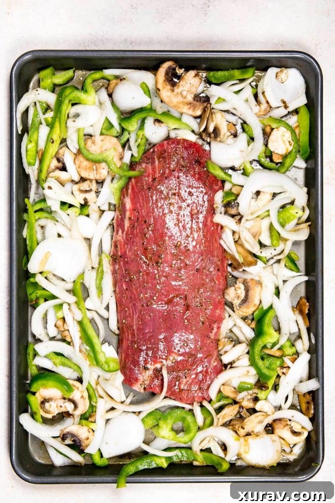 Delicious Sheet Pan Philly Cheesesteaks: A quick and easy dinner idea with tender beef and melted cheese.