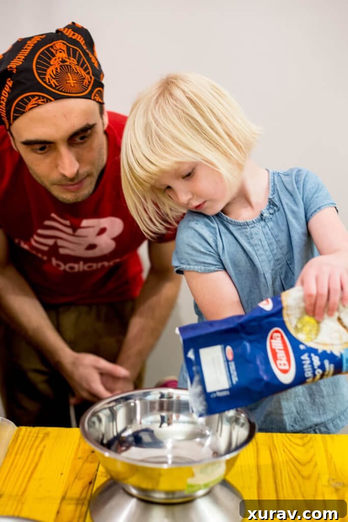 Rome with Kids CC making PASTA in ROME measuring flour