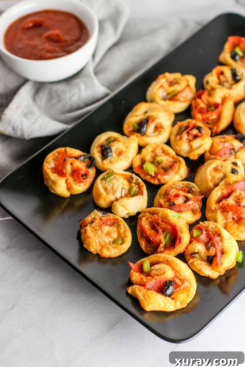 These Supreme Pizza Pinwheels are the perfect appetizer to please the whole crowd!