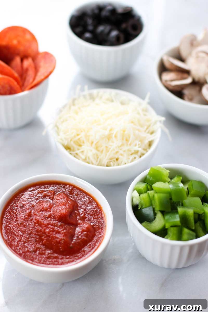 Delicious Supreme Pizza Pinwheels piled high on a serving platter, ready for a party.