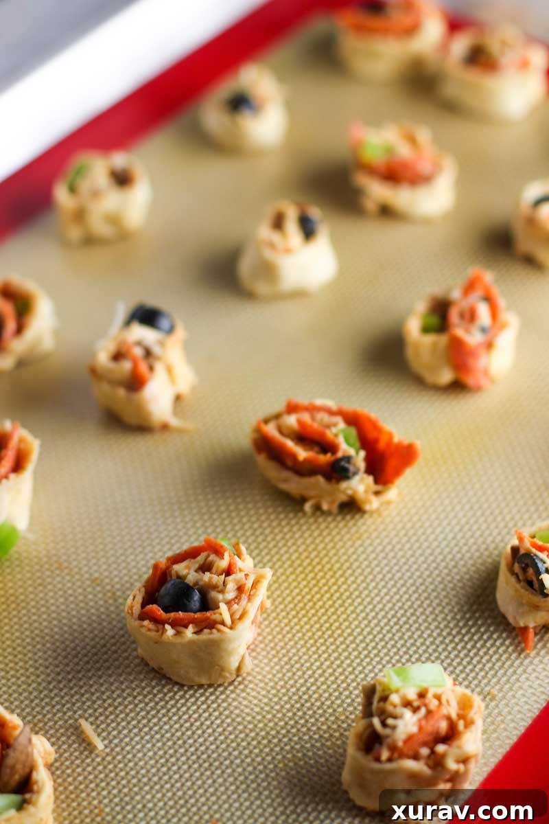 Preparing Supreme Pizza Pinwheels, showing the crescent dough spread out with toppings.