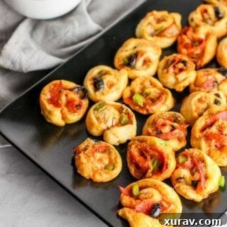 These Supreme Pizza Pinwheels are the perfect appetizer to please the whole crowd!
