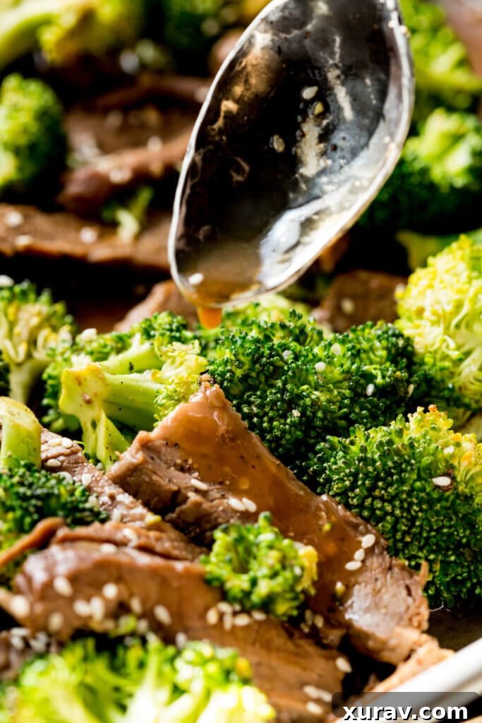 Spooning sauce over beef and broccoli