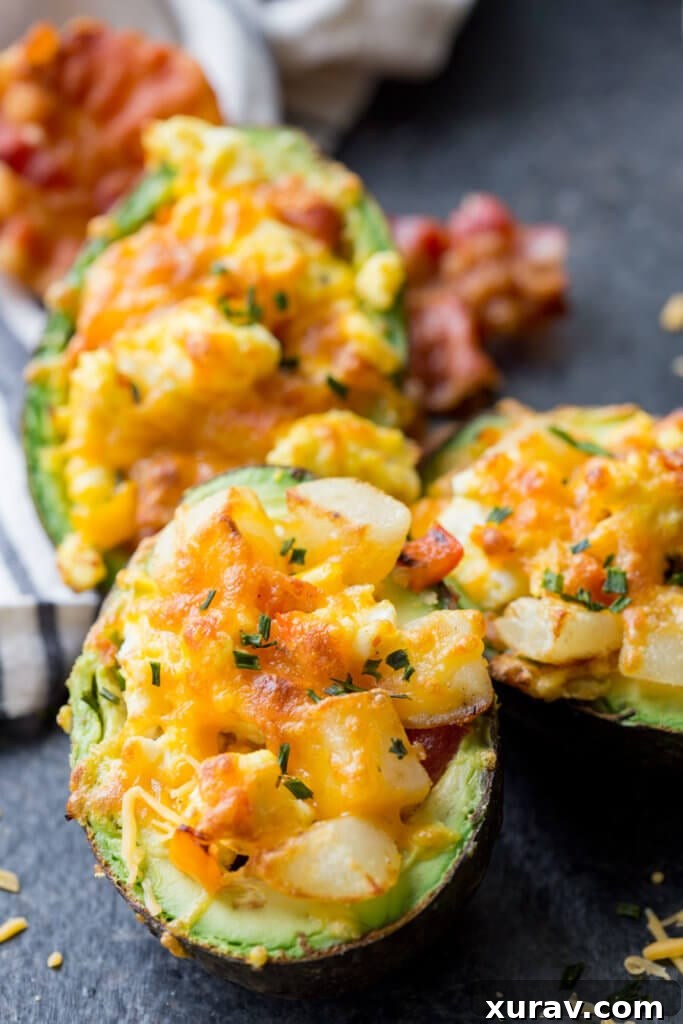 Breakfast Stuffed Avocados, avocado stuffed with eggs, bacon, and potatoes