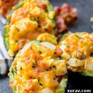 Breakfast Stuffed Avocados, avocado stuffed with eggs, bacon, and potatoes