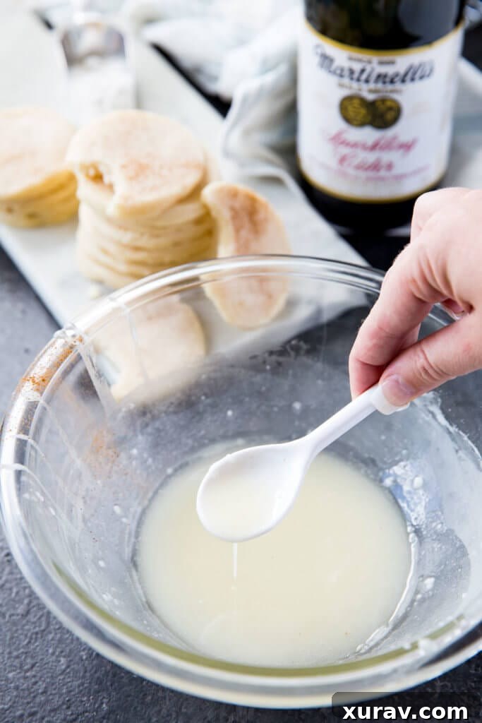 Martinelli's Apple Glazed Shortbread Cookies Close-up of the apple glaze being prepared for the shortbread cookies, showing its smooth consistency.