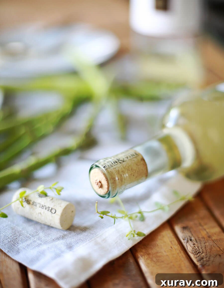 Beautifully cooked haddock fillets on a plate, garnished and ready to serve with a delicious wine sauce.