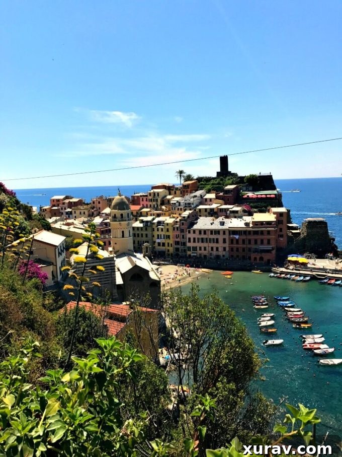 Travel free: Kacee Houle, travel expert, standing on the cliffs of Cinque Terre, Italy, achieved with free travel points