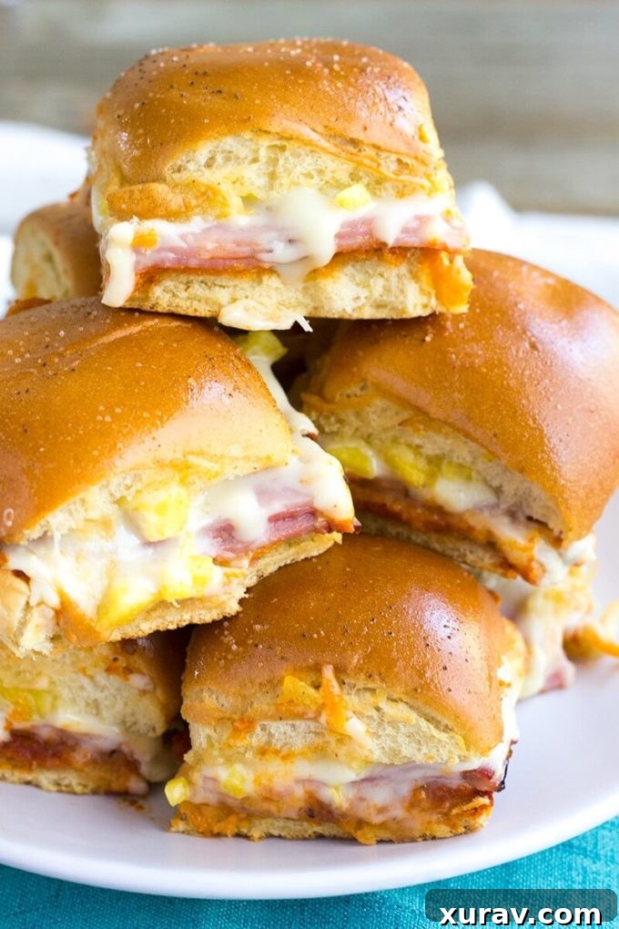 Hawaiian Pizza Sliders: An easy appetizer for your next party, featuring sweet ham, tangy pineapple, and melted mozzarella on soft rolls.