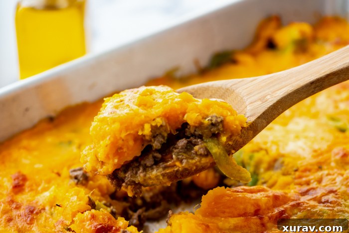 Close-up of fresh ingredients for Sweet Potato Shepherd's Pie, including sweet potatoes, garlic, and mixed vegetables