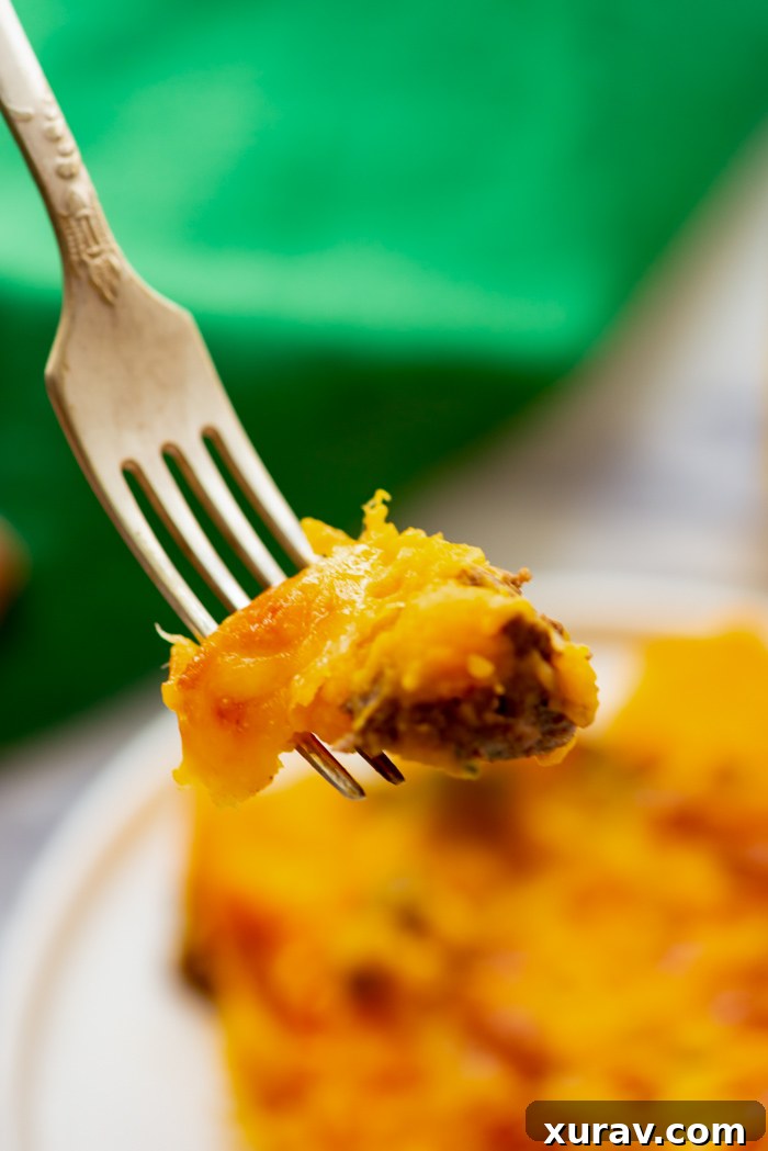 A complete meal featuring Sweet Potato Shepherd's Pie with a side salad and rolls