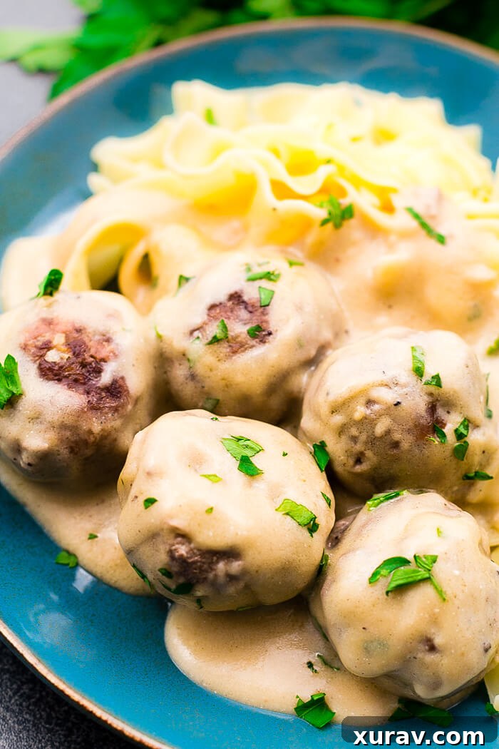 Swedish Meatballs with Gravy Close-up of freshly cooked Swedish Meatballs in creamy sauce, garnished with parsley