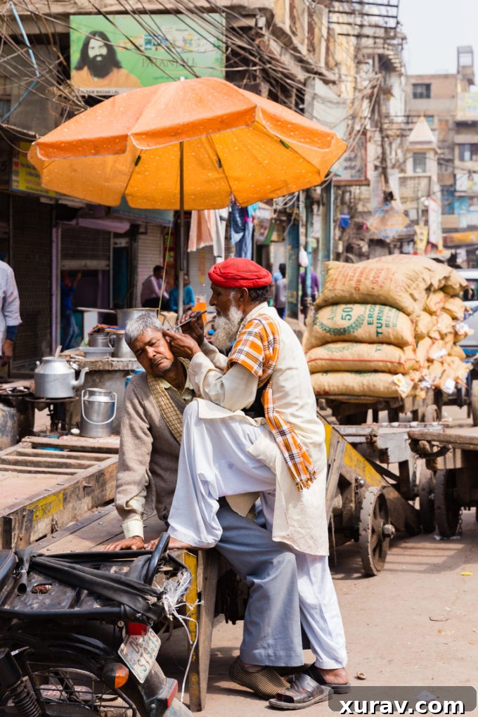 Man having his ears cleaned on the streets of Delhi