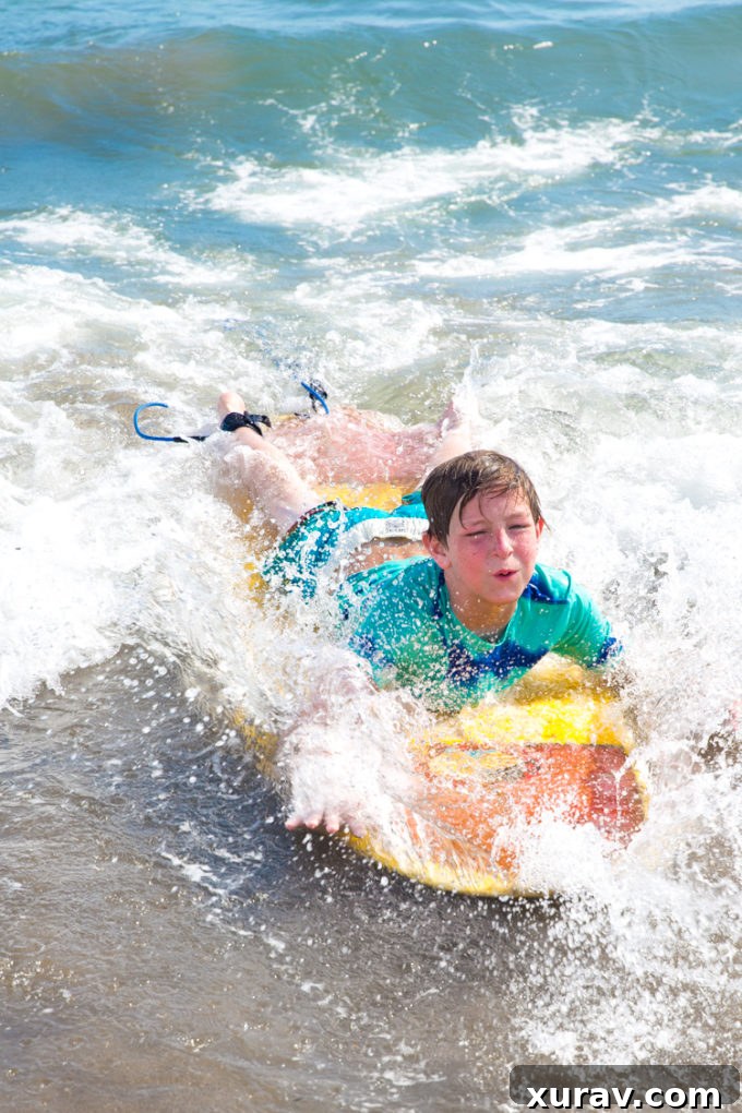 Enjoying an unforgettable beach vacation with the best products for beach fun, featuring boogie boards and sun protection.