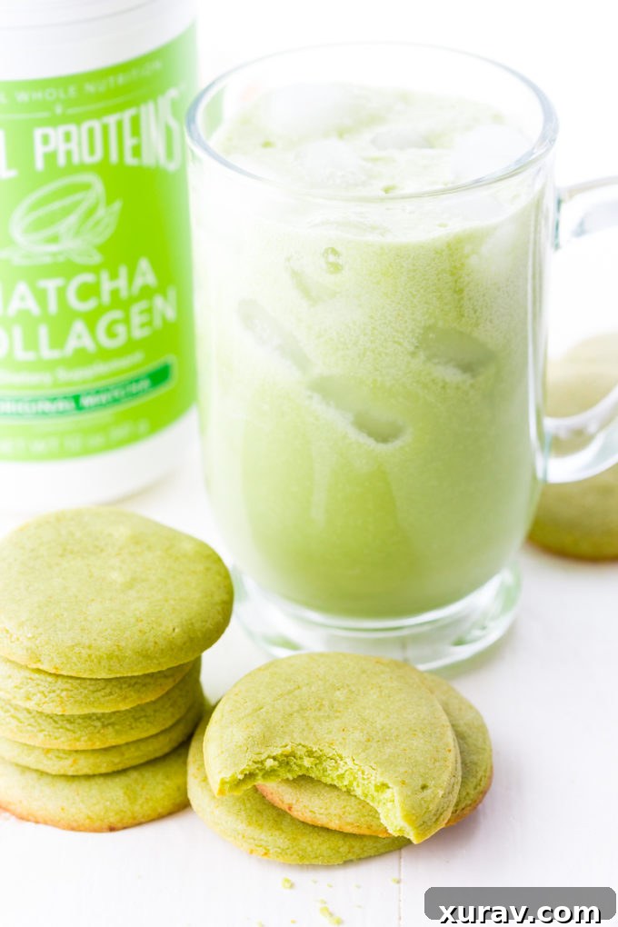 Matcha shortbread cookies arranged next to a refreshing iced matcha latte, showcasing perfect pairing.