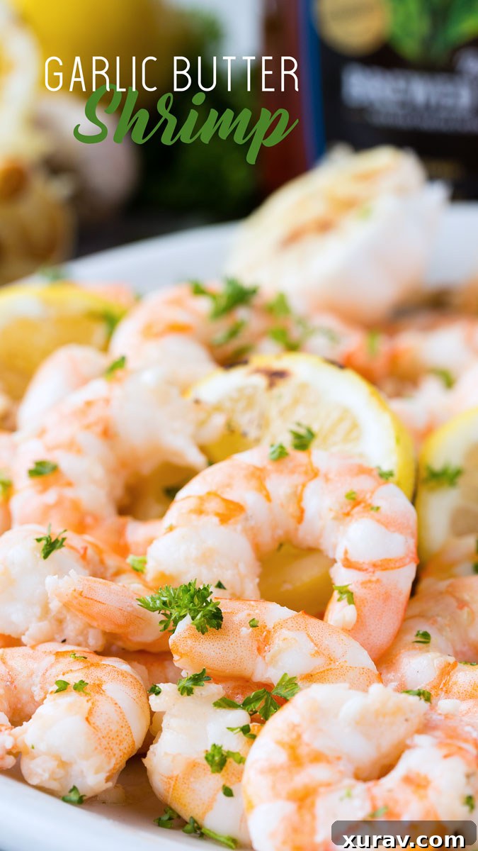Pinterest graphic for Garlic Butter Shrimp, featuring the plated dish and enticing text to pin the recipe for summer entertaining.
