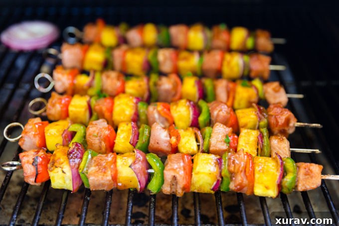 Cooking sticky bbq pork kabobs on the grill, 6 kabobs cooking