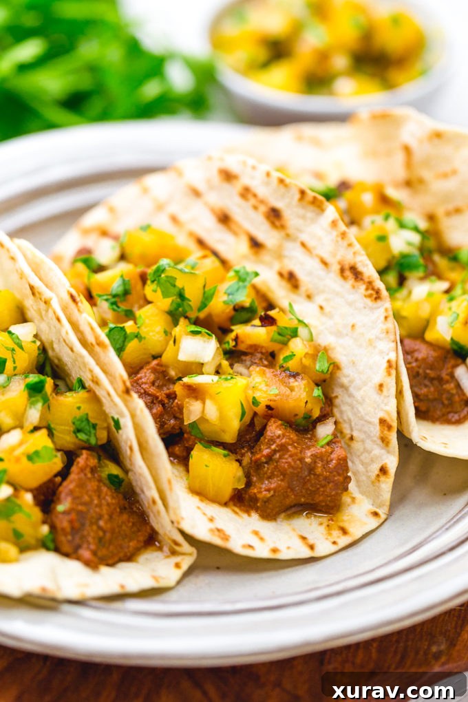 Tacos al pastor, richly flavorful pork al pastor tacos with a pineapple pico