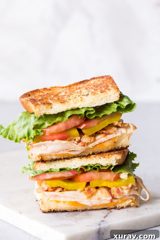 Effortless Chicken Club Stack 2 Easy Chicken Club Sandwich, perfectly assembled and ready to eat, highlighting the layers of ingredients.