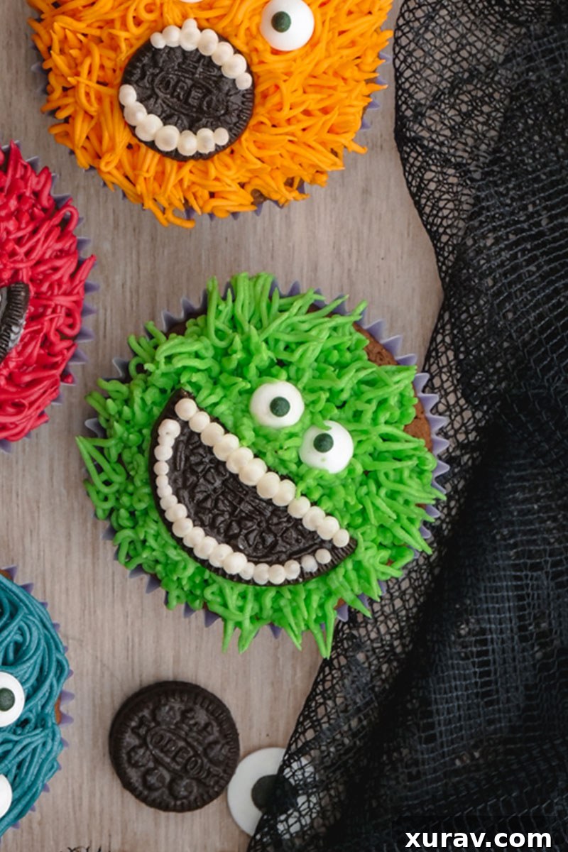 A green monster cupcake with an OREO mouth