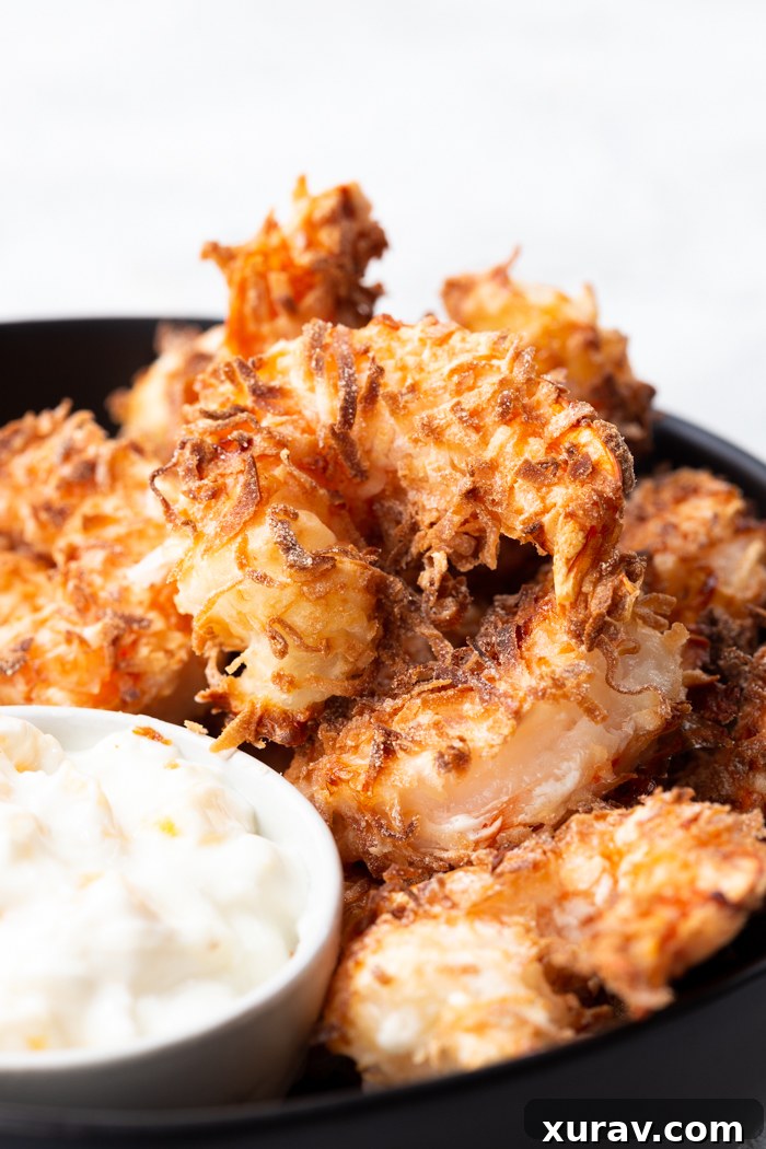 Delicious and easy air fryer coconut shrimp, golden brown and perfectly crispy
