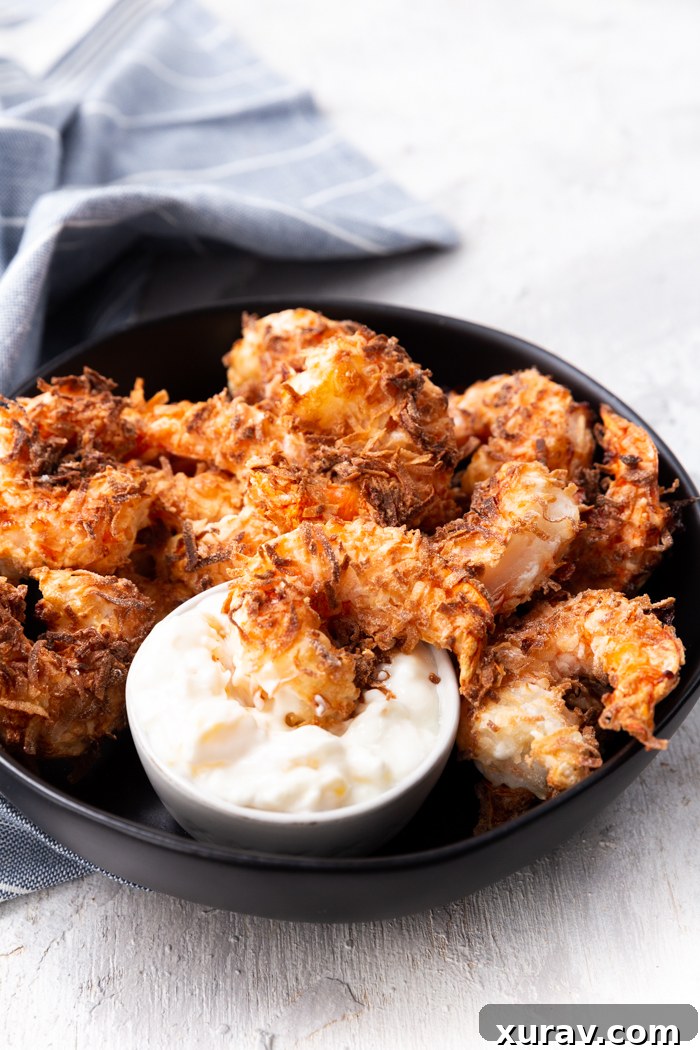 Crispy coconut shrimp, this crunchy delicious coconut shrimp is delicious and crisp. Served with tropical dipping sauce.