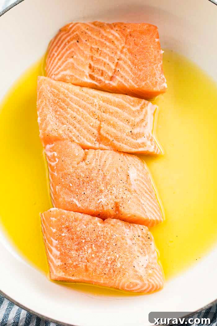 Step two for this salmon recipe is adding in your seasoned salmon fillets