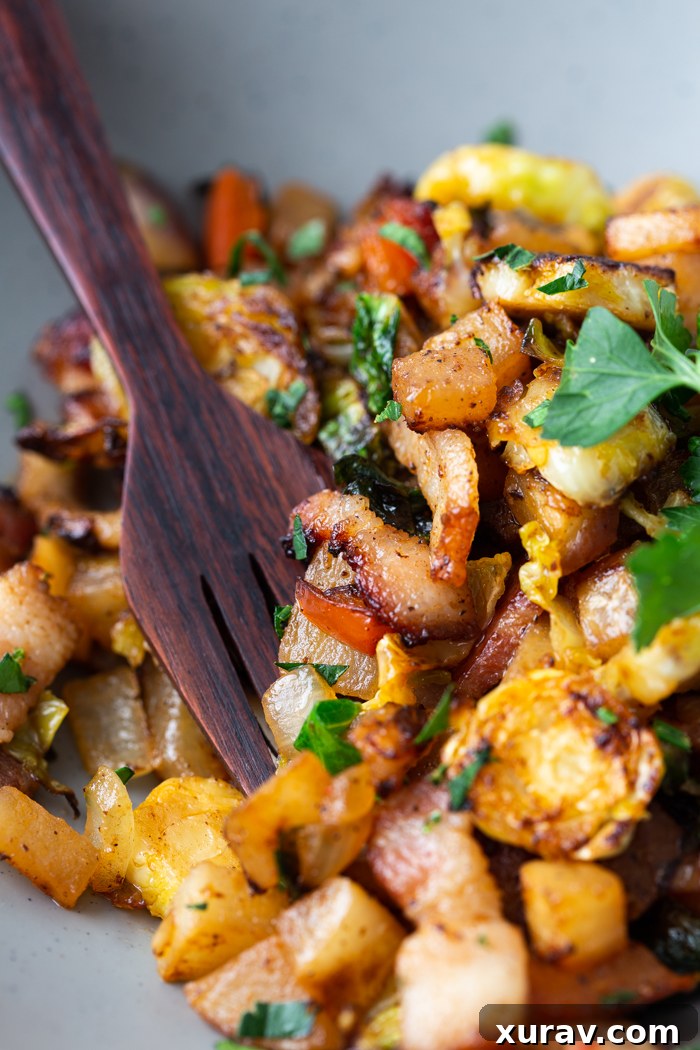 Keto breakfast hash close up with wood fork inserted