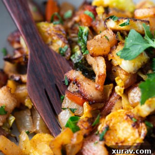 Keto breakfast hash close up with wood fork inserted